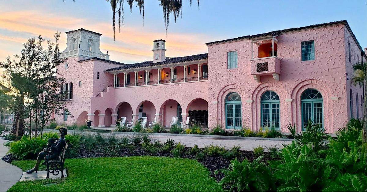 The unique pink exterior of The Hacienda, a historic boutique hotel.