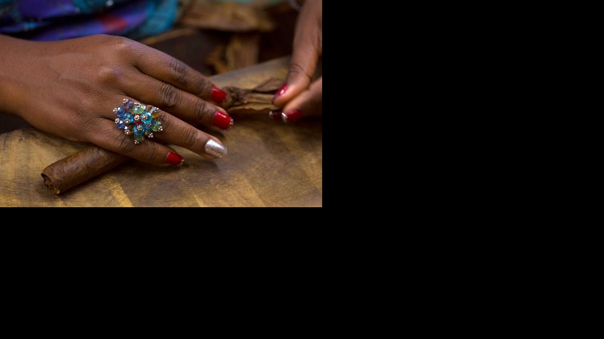 
Caridad Perez Castro, 35, rolls a cigar at the Corona cigar factory in Havana.

