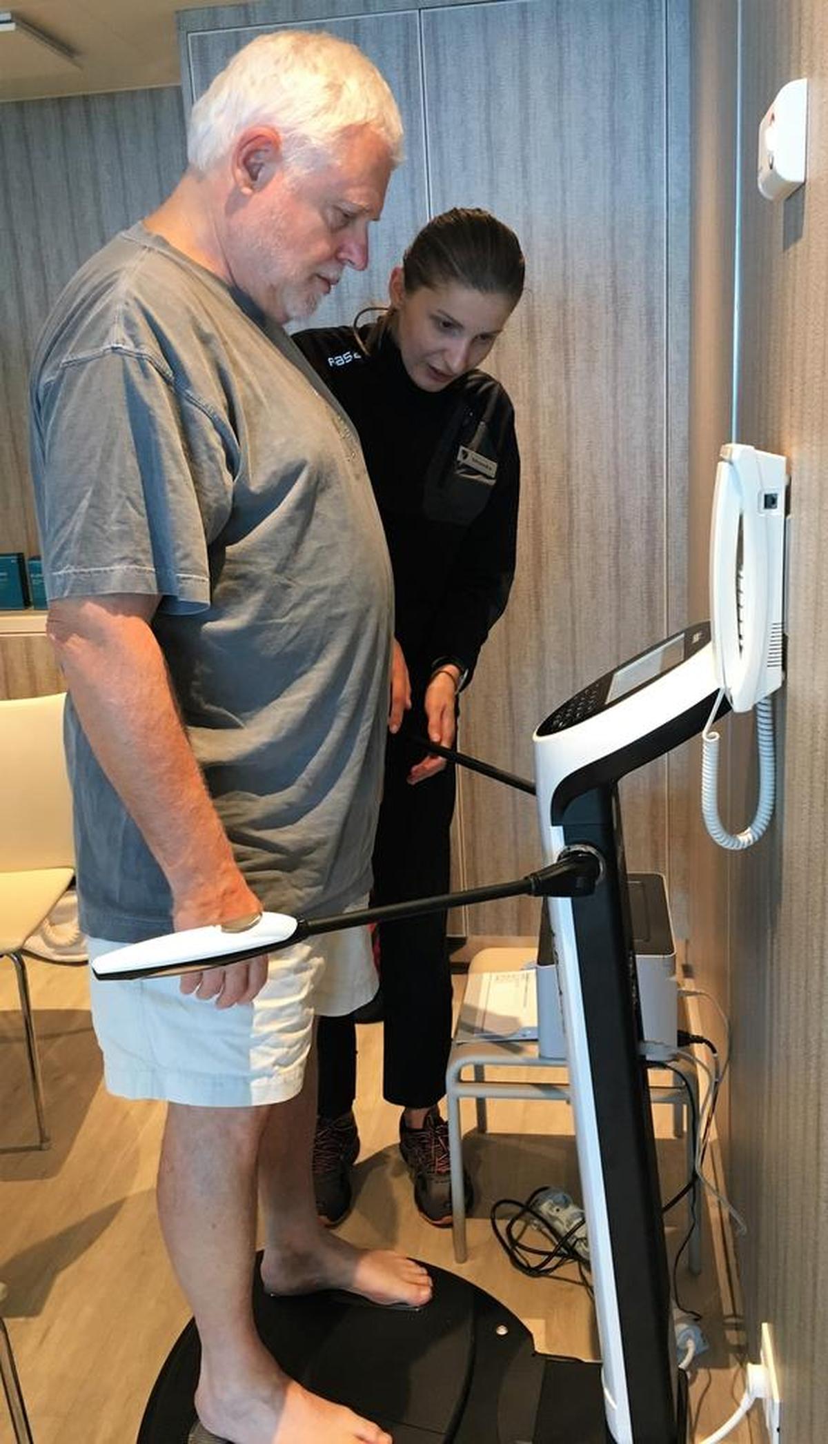 A passenger weighs in for a body exam and workout plan, as Seabourn Encore cruises from Egypt to Oman