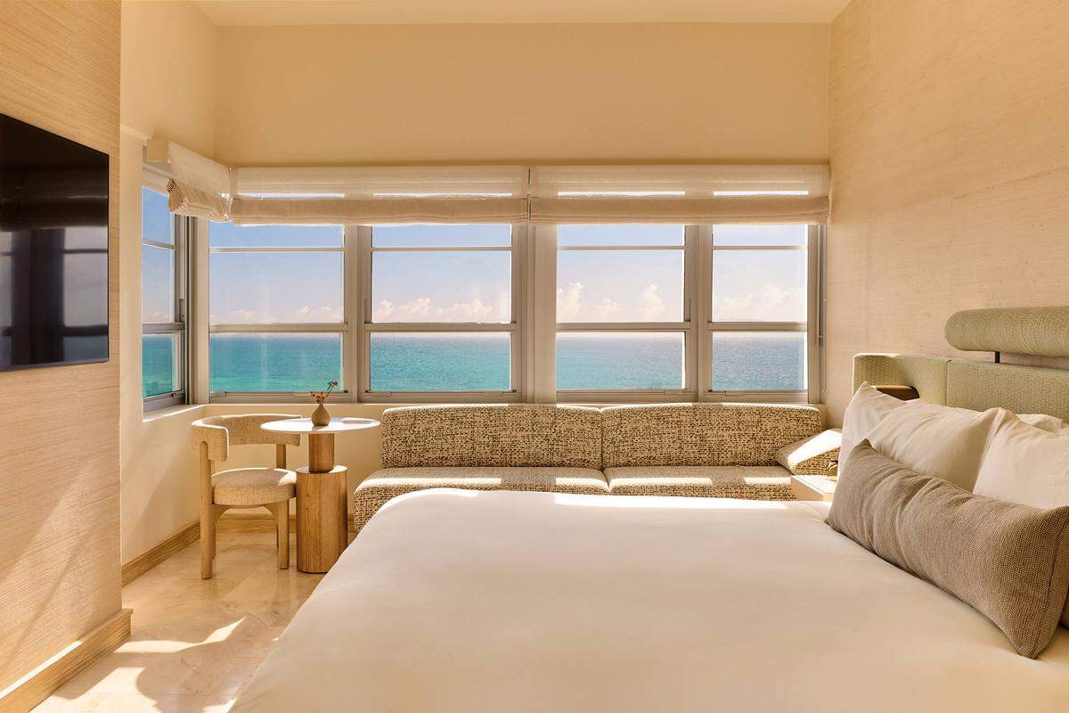 Spacious guestroom with sleek furnishings and panoramic views of the Atlantic.