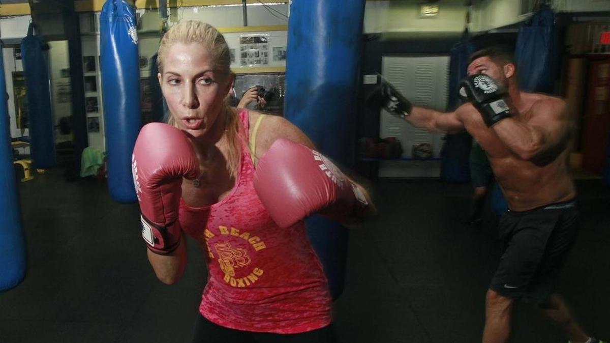 Above and below, Jolie Glassman, owner and founder of South Beach Boxing, works out at her gym in Miami Beach..