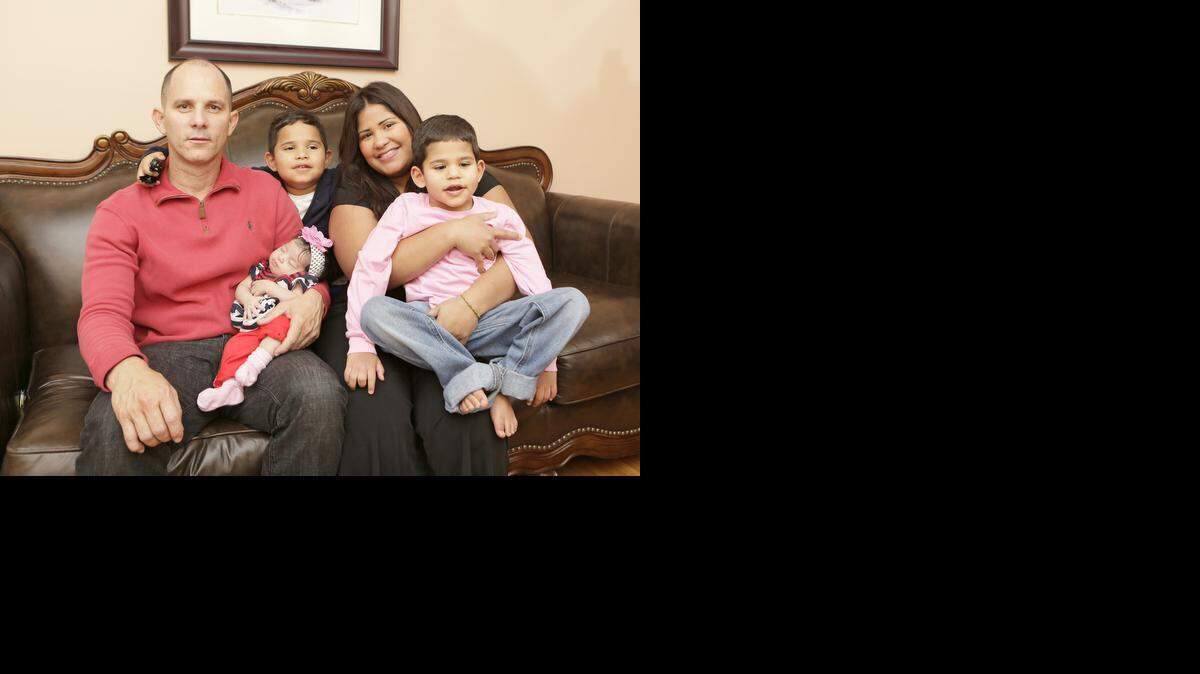 
In Hialeah, from the left: Dad Alfredo Rojas holds 1-month-old daughter Daniella; Daylan, 5; and mom Giselle with Angel, 4. 
