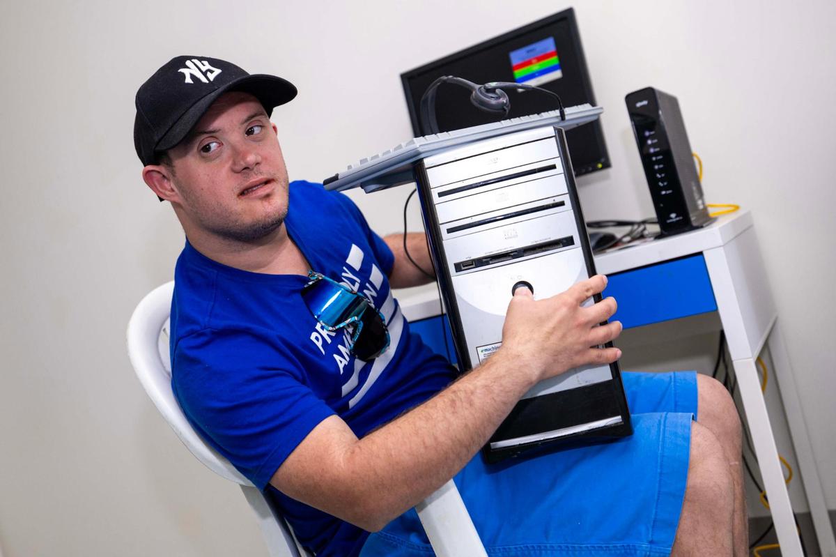 Eduardo Perez, 30, has Down syndrome and relies on his computer to connect with the world of music and assist with his homework. But when it broke down, he was left struggling with the limitations of his smartphone.