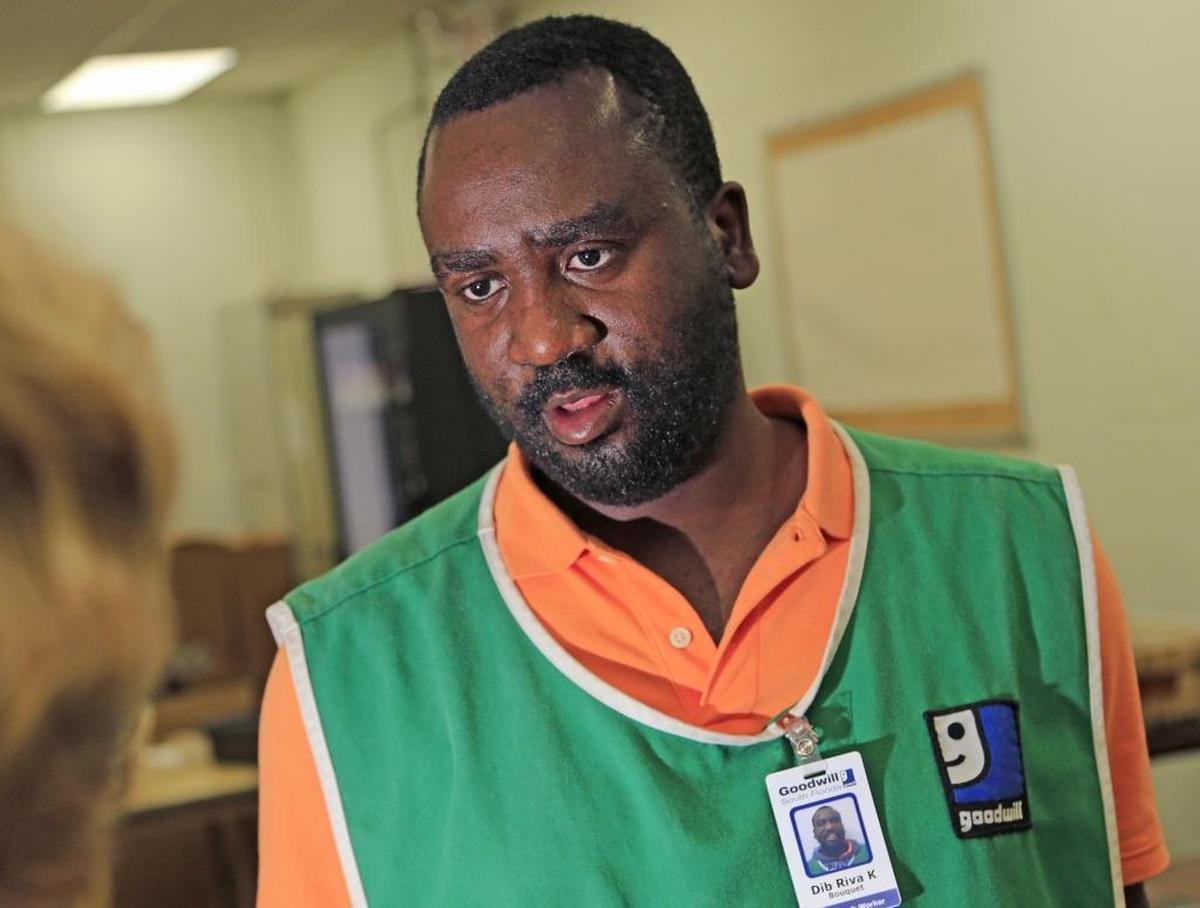 Keli, who has a learning disability, grew up in foster care and is seen here working at Goodwill in Miami.