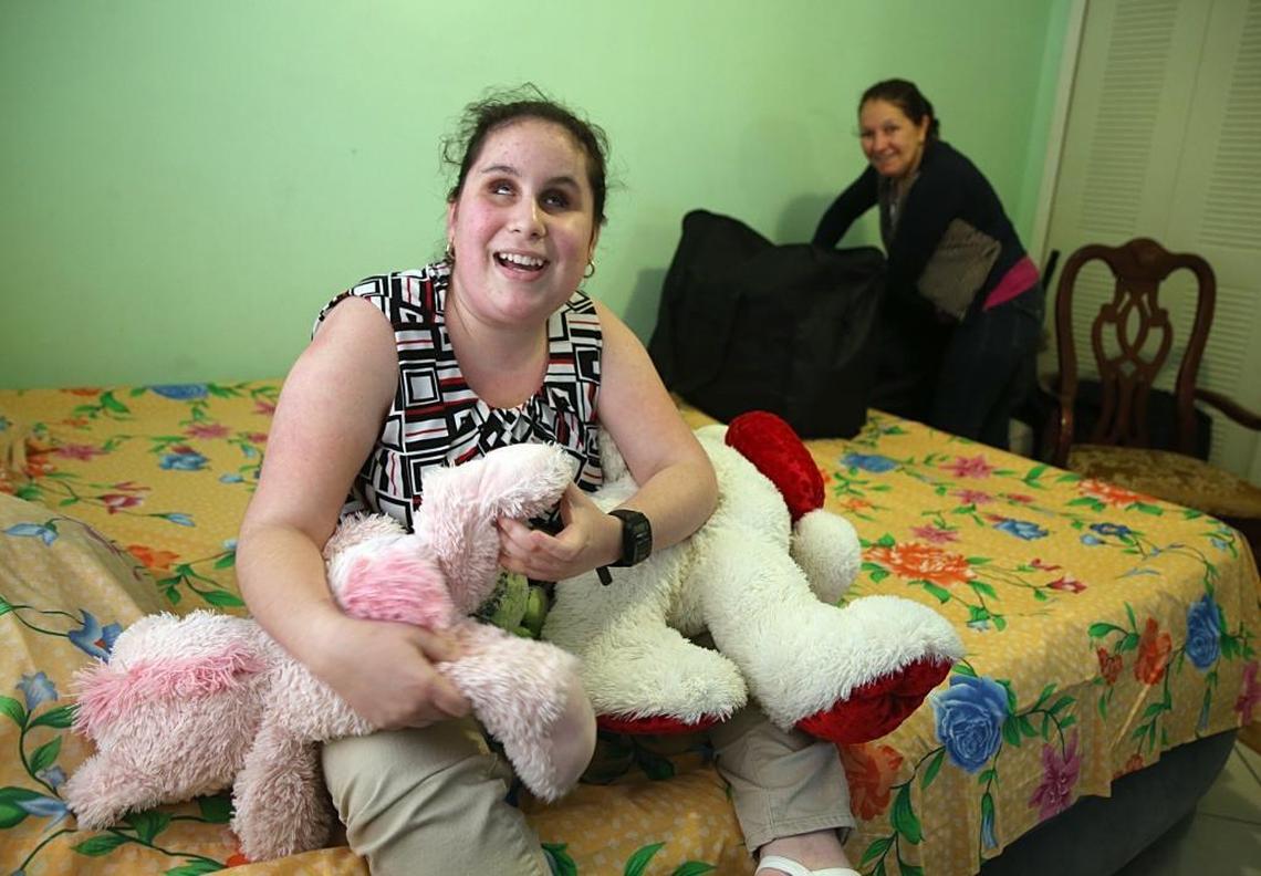 Katherine Sanchez, a blind 15-year-old, holds her favorite stuffed animals on Nov. 17, 2017. She and her mother, Katia Triana, have been getting by on a monthly disability check.