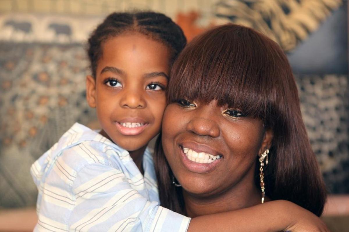Ezra William Moise with his mother, Britania Jacques. Ezra wants a laptop. His single mom was in a car accident and is still trying to recover.