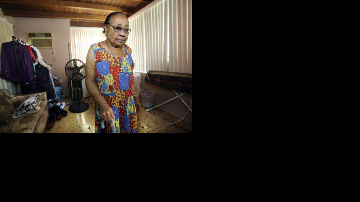 NO SAFE ZONE:  Carmina Peralte, 80, in her home near North Miami.