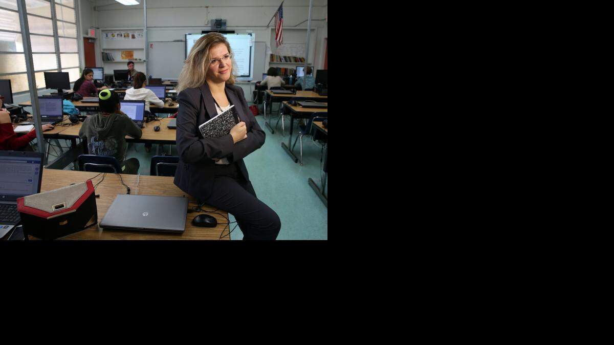 
Ilona Borysyak, a Ukrainian woman who moved to Miami from Germany after her husband died. Ilona has a degree in finance from the University of Kiev but has been having trouble finding a job. She's been taking English classes at the district's adult ed center and when she wrote about being a young widow without a country. She is in class at The English Center Monday Dec. 1, 2014.
