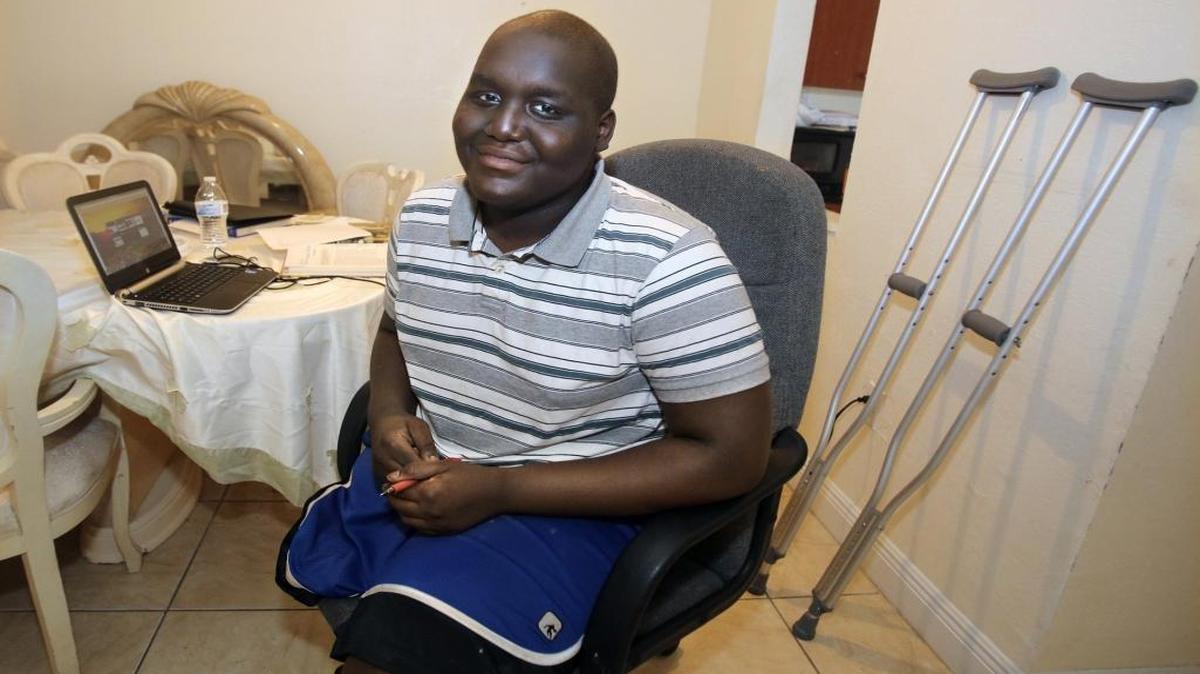 Patrick Vixamar, 17, is recently into remission from bone cancer, which caused him to lose one of his legs. Patrick, who is home schooled at the Miami Gardens apartment he shares with his father, stepmother and three younger siblings, uses an older HP laptop for his studies. He has requested an Apple laptop to replace the more limited laptop he is using. Patrick was photographed Thursday, Nov. 19, 2015 at the dining room table where he does his schoolwork.
