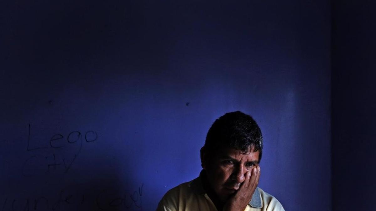 Pedro Linares in his bedroom at his Homestead home that is in disrepair on Dec. 9.
