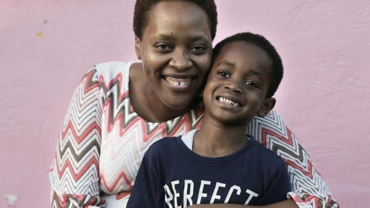 Five-year-old Elliott and his mother, Hasina Brinson, pictured outside their Buena Vista home, which has roof leaks from Hurricane Irma.