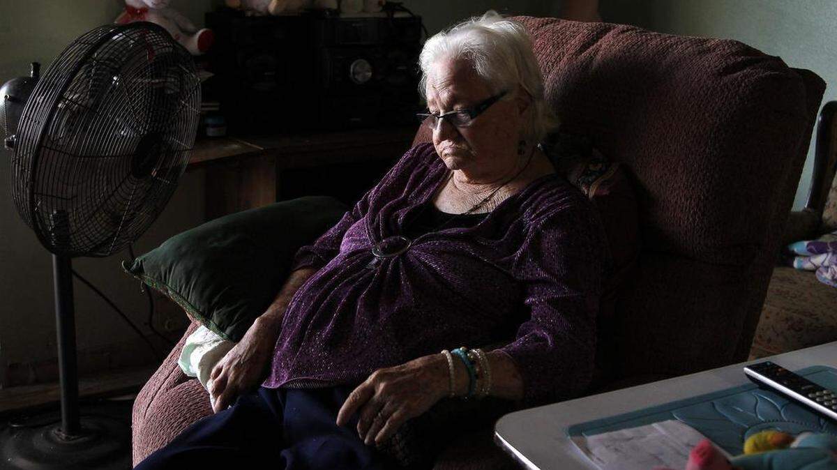 Norma Minsal, 94, sits in her apartment that is dire need of repair - faulty a/c, kitchen and bathroom are in need of remodeling.