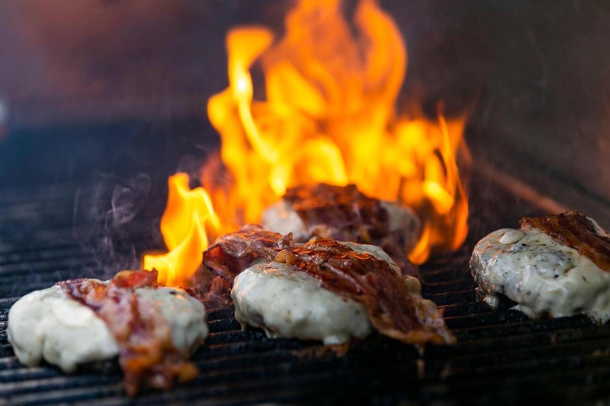 109 Burger Joint Chef Luis Blanco (not pictured) prepares his BBQ Blues burgers during the South Beach Wine & Food Festival’s Burger Bash in Miami Beach, Florida on Thursday, May 20, 2021.