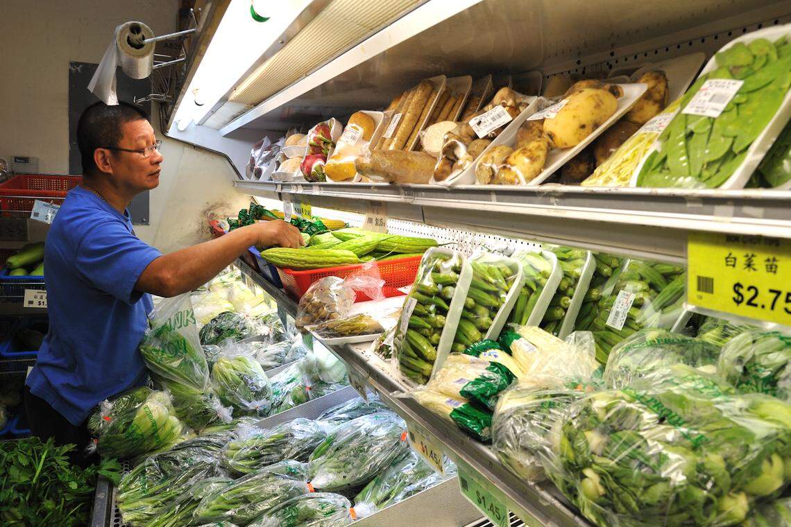 Hialeah Gardens resident Kwok Wong peruses the produce selection at P K Oriental Market in North Miami Beach, Thursday, Aug. 5, 2010. Located at 255 NE 167th St., the store offers a wide selection of products for the local Asian community.