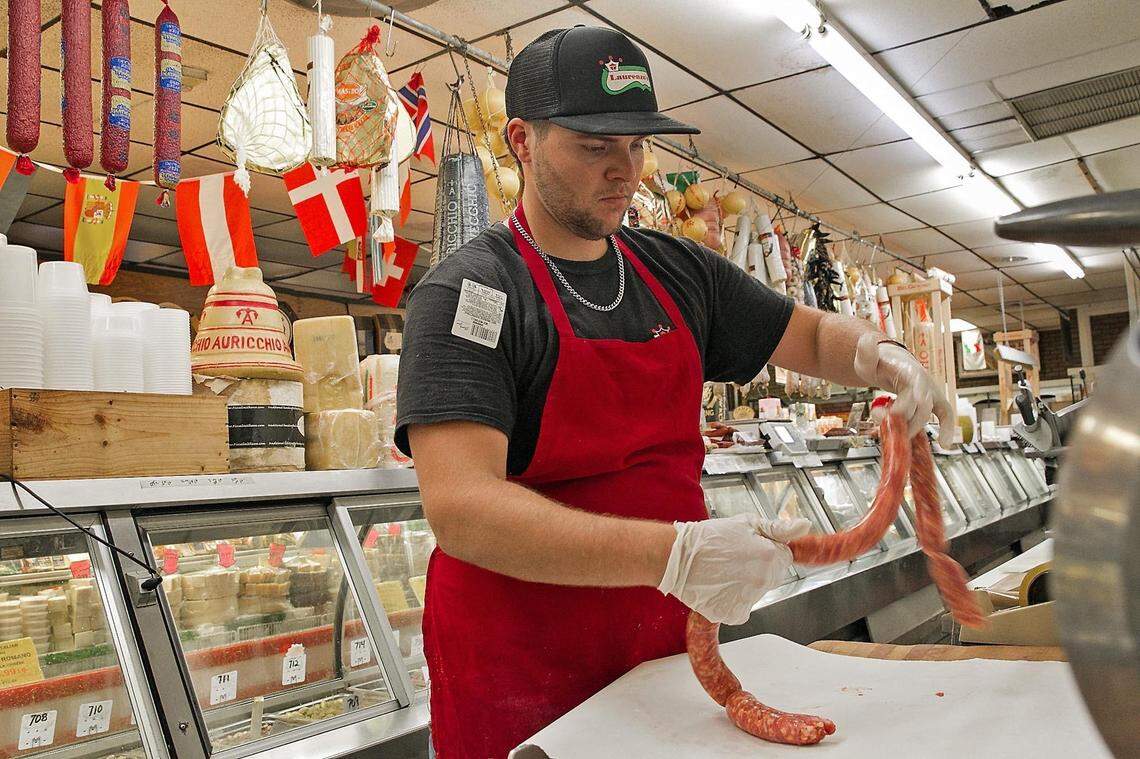 Vinnie ‘The butcher’ Covillo links sausages at Laurenzo’s Italian Market in North Miami Beach on Friday, June 22, 2018