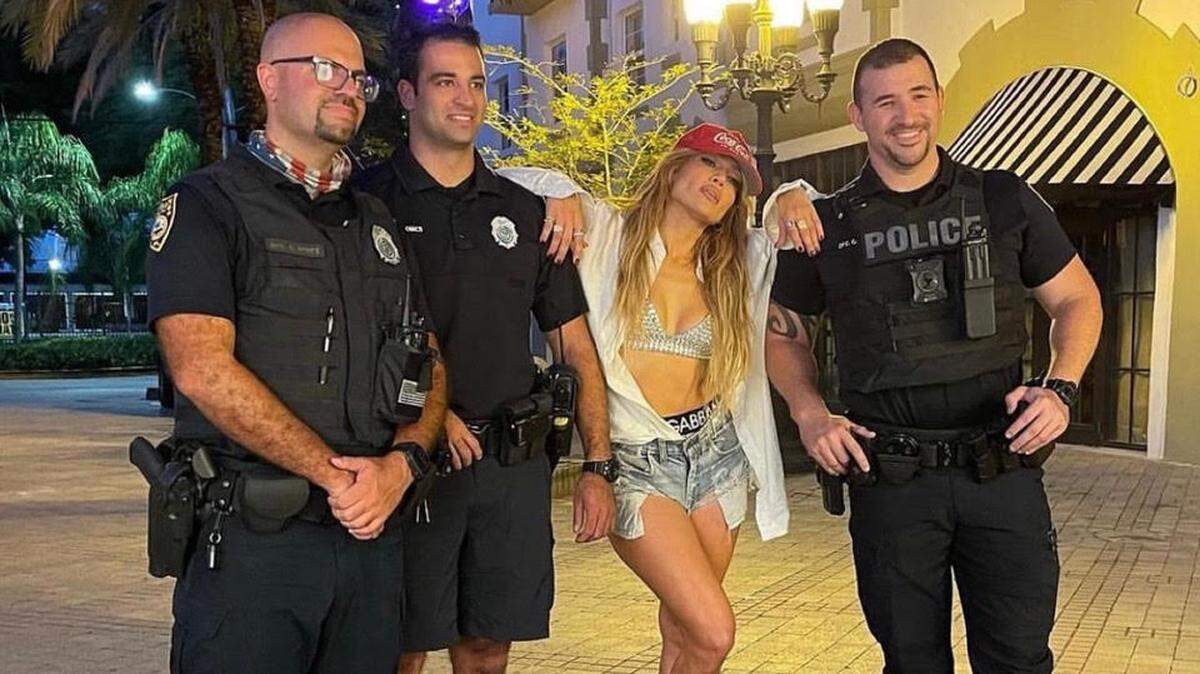 JLo hangs out with Miami Dade police officers as she films a video in Miami Beach’s Espanola Way.