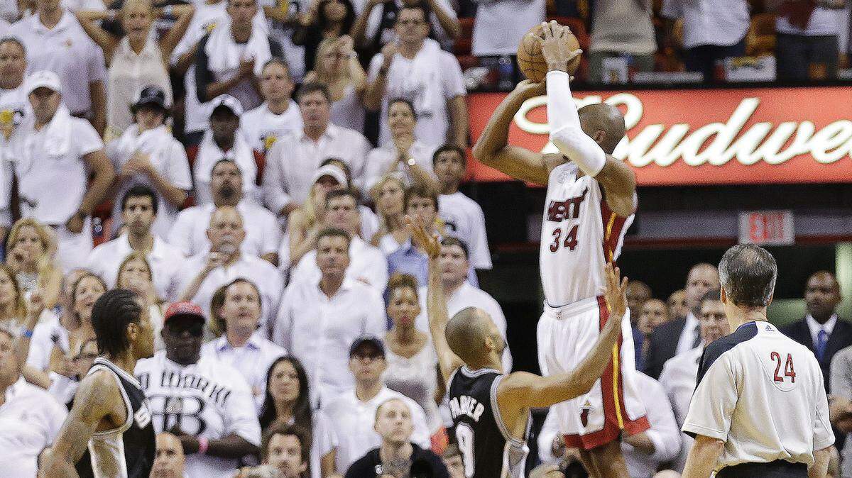 Miami Heat's Ray Allen (34) shoots a 3-point basket in the final seconds of regulation of Game 6 of the NBA Finals basketball game against the San Antonio Spurs in Miami. Allen's shot sent the game into overtime. (AP Photo/Lynne Sladky, File)