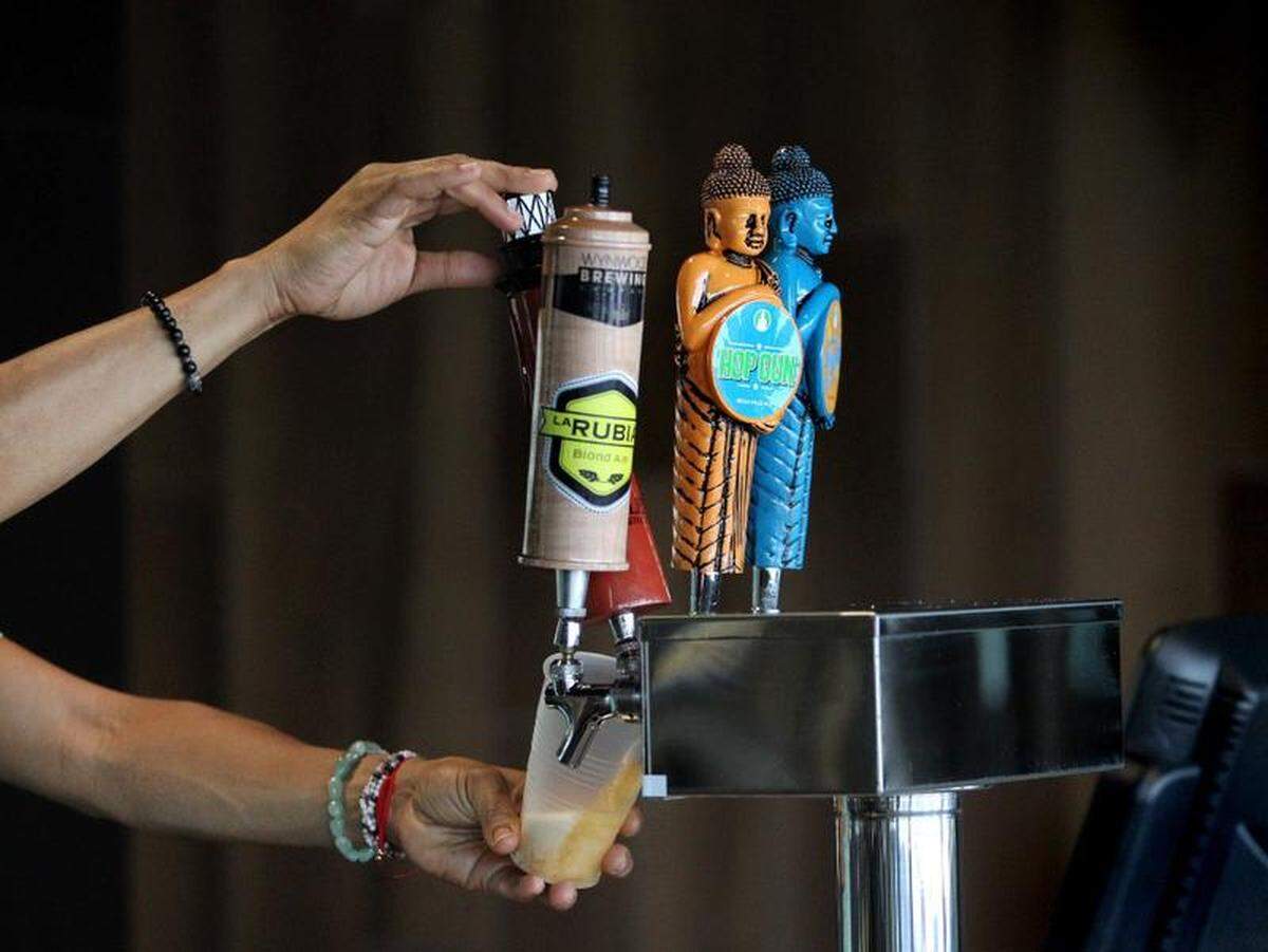Craft beers are poured from the Tap Room as the Miami Dolphins unveil some of their new concessions on Tuesday, August 8, 2017.
