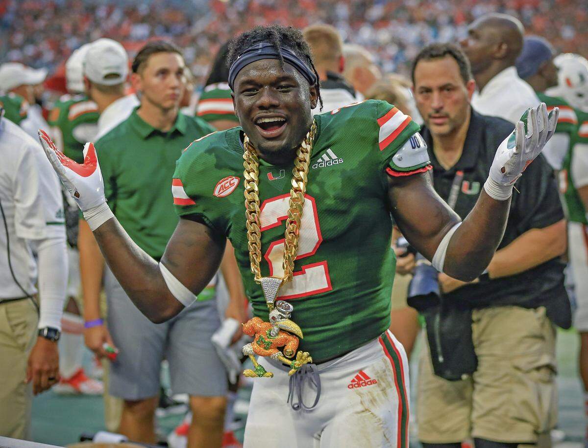 Miami Hurricanes defensive back Trajan Bandy shows off the true turnover chain.