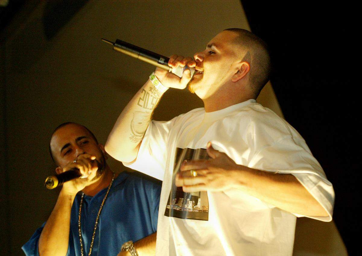 Miami, FL--11/23/04--Joshua Prezant/ for the Herald--Rapper Pitbull ( right) performs Tuesday night at the second annual Miami Awards at Players night club. Pitbull won several awards.