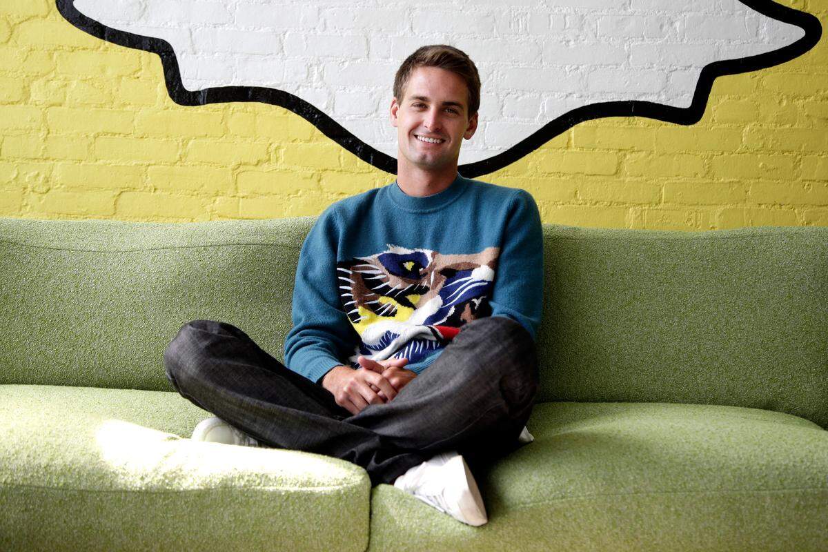 In this Thursday, Oct. 24, 2013, Snapchat CEO Evan Spiegel poses for photos, in Los Angeles. Spiegel dropped out of Stanford University in 2012, three classes shy of graduation, to move back to his father's house and work on Snapchat. Spiegels fast-growing mobile app lets users send photos, videos and messages that disappear a few seconds after they are received (AP Photo/Jae C. Hong)