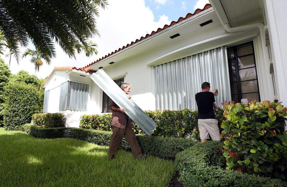 Fact: Real friends help you put up the shutters even if it's 90 degrees out.