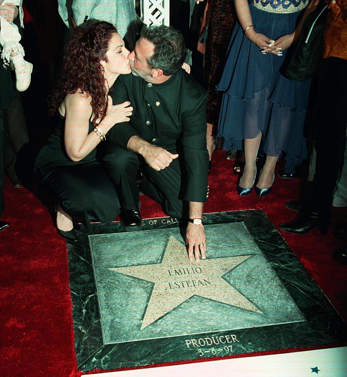 Photo Hector GAbino - Gloria Estefan kisses Emilio Estefan during the  ceremony Thursday night at Calle Ocho. He got a star at the street at 17 Av. The star was giving by "Estrellas de la Calle Ocho" They were around 2,000 fans, friends and important politicians and celebrities of the music industry.