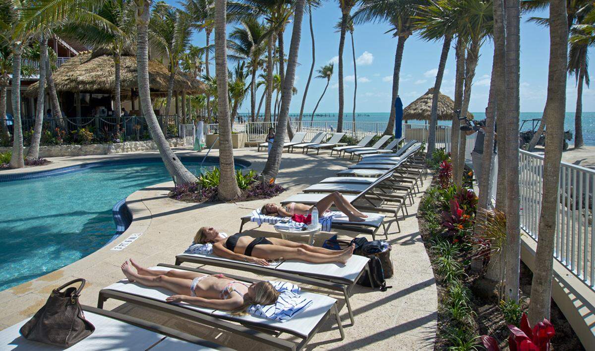 In this photo provided by the Florida Keys News Bureau, Ashley Sheppard and her daughters enjoy the pool at Cheeca Lodge Resort &amp; Spa (Andy Newman/Florida Keys News Bureau via AP)