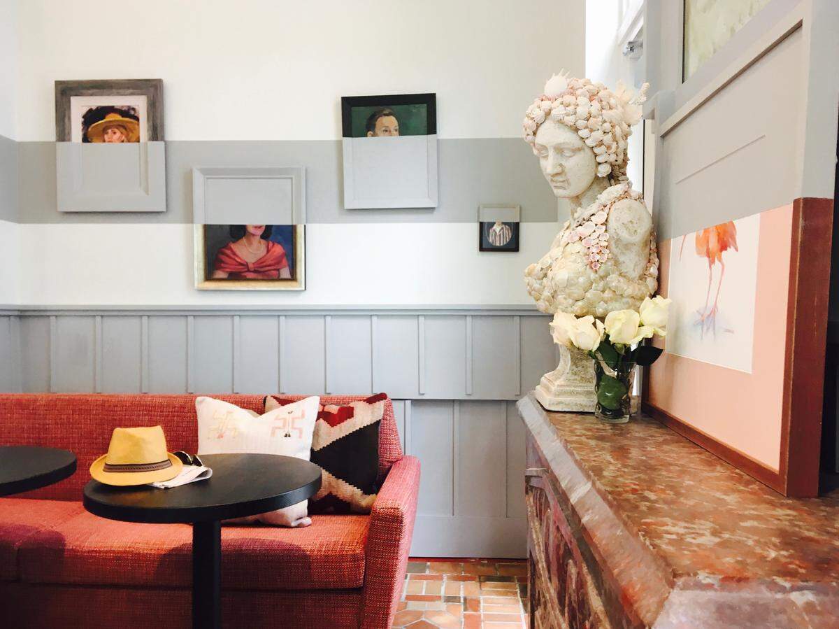 The lobby art of The Julia is a playful twist on a Victorian portrait gallery.