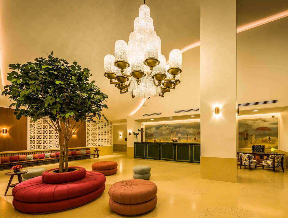 The cascading chandelier inside The Confidante's mid-century modern lobby.