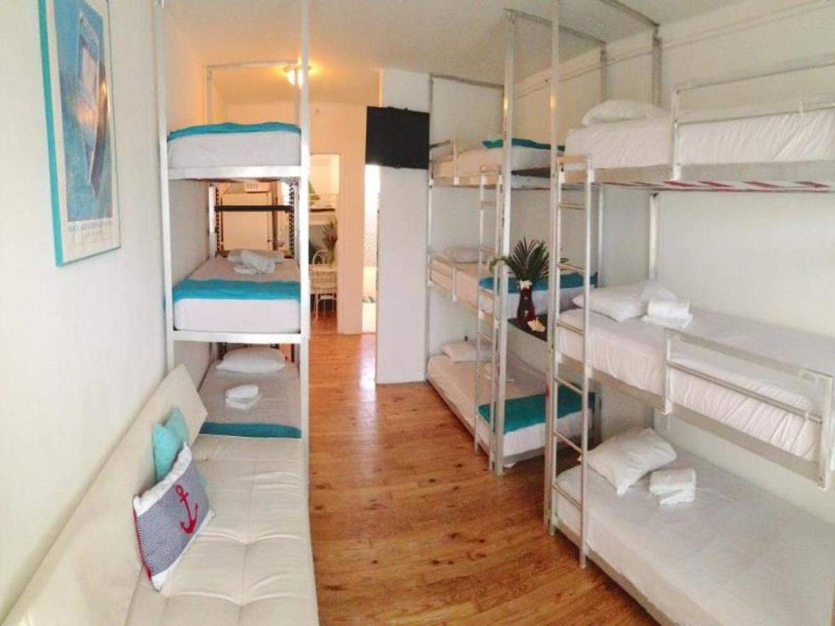 This hostel, located at 1255 West Avenue, has free Wifi, a hot tub and bar for $14 a night. But you have to sleep in a bunk. via agoda.com
