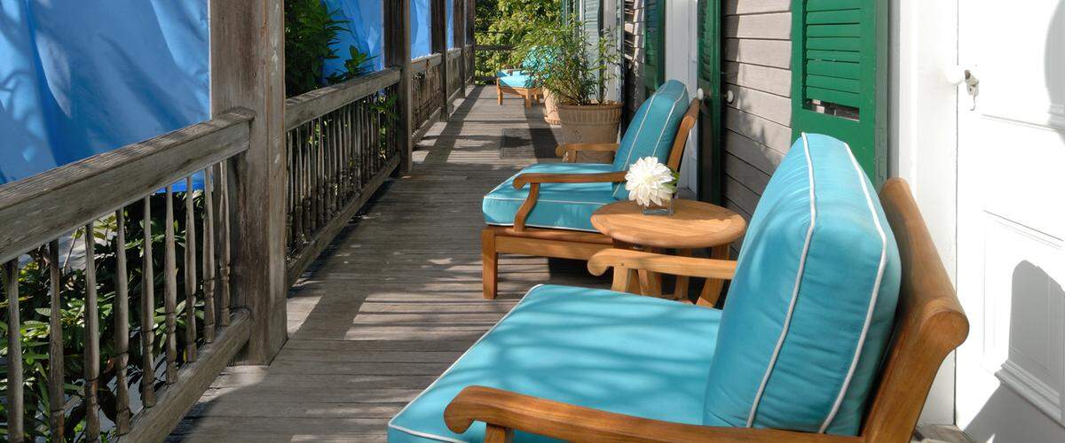 An inviting balcony overlooking Simonton Street at Cypress House.