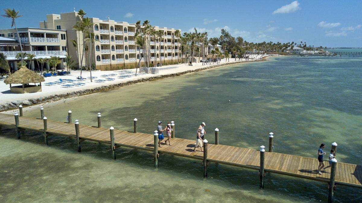 Guests at Cheeca Lodge Resort & Spa walk on a new 525-foot-long pier at the iconic Florida Keys resort Friday, March 30, 2018, in Islamorada, Fla. (Andy Newman/Florida Keys News Bureau via AP)