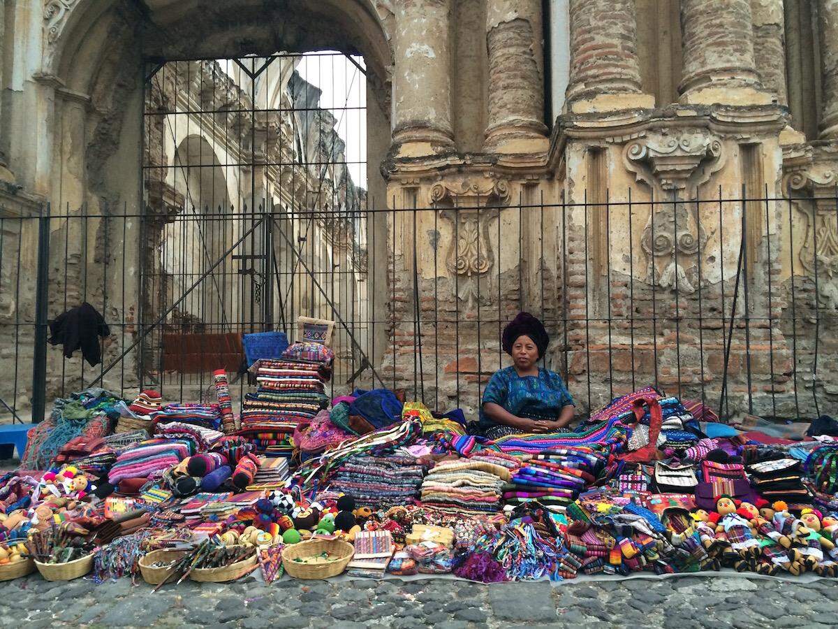 An artisan sells her wares at Mercado del Carmen.