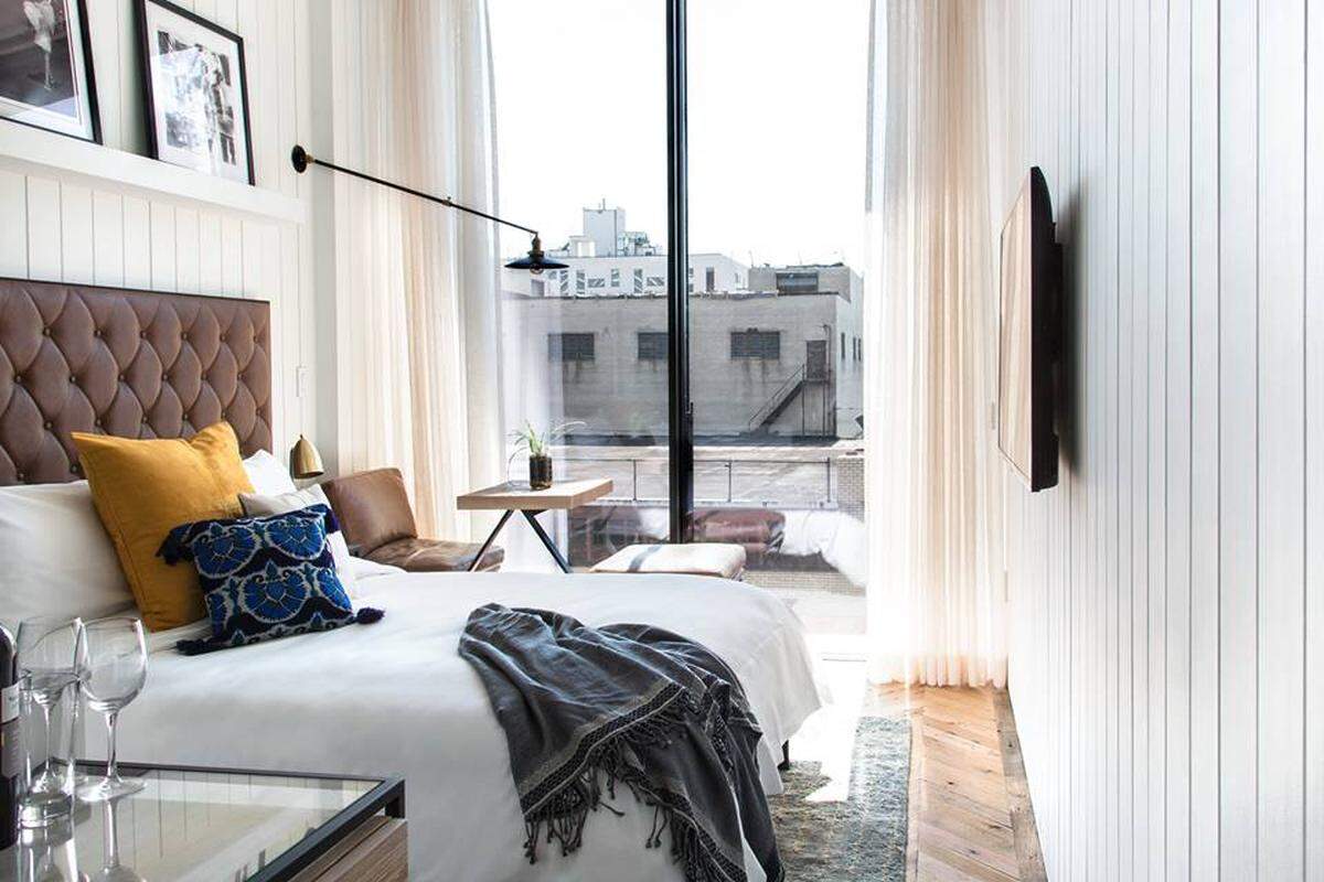 Cozy rooms with enormous floor-to-ceiling sliding glass doors characterize The Williamsburg Hotel.