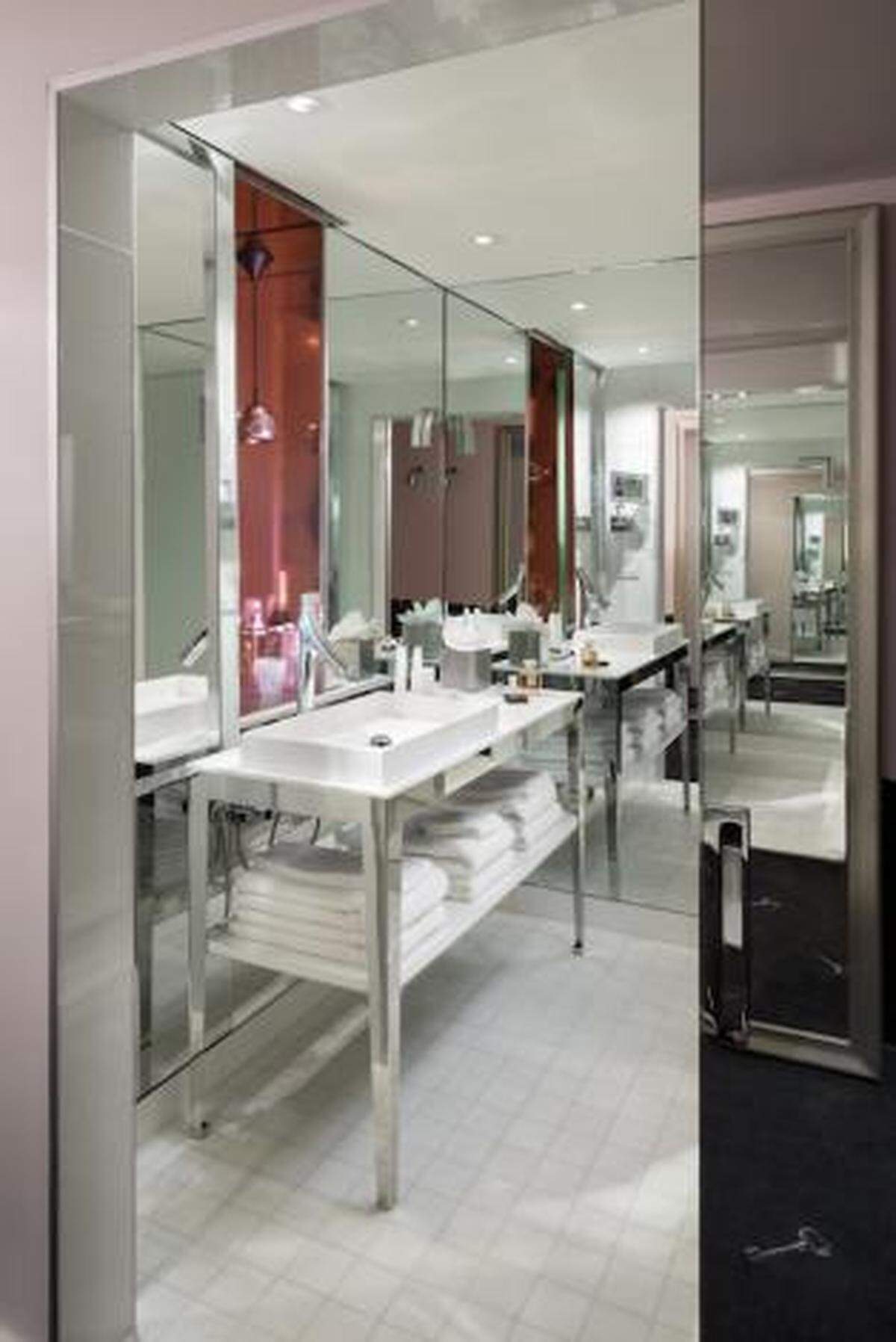 The mirrored entryway to the bathroom.