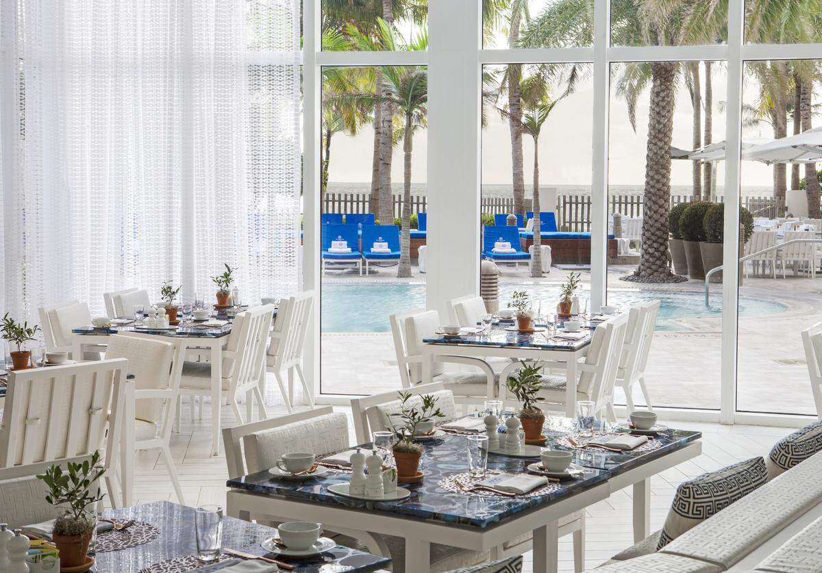 The dining room at Atlantikós, a new Greek restaurant at The St. Regis