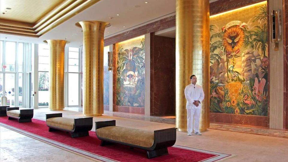 Porters Yandy Lopez, 41, stands ready to receive guests as the Faena Hotel Miami Beach gears up to open on its doors on Monday, November 30, 2015 just days before Art Basel. The hotel won five stars this year for the first time from Forbes Travel Guide.