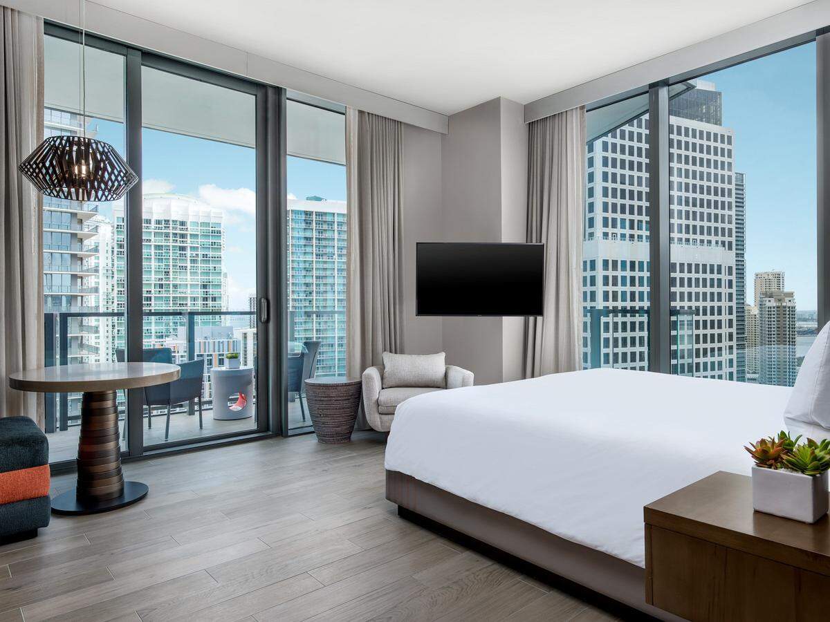A guest room with floor-to-ceiling windows at EAST, Miami.