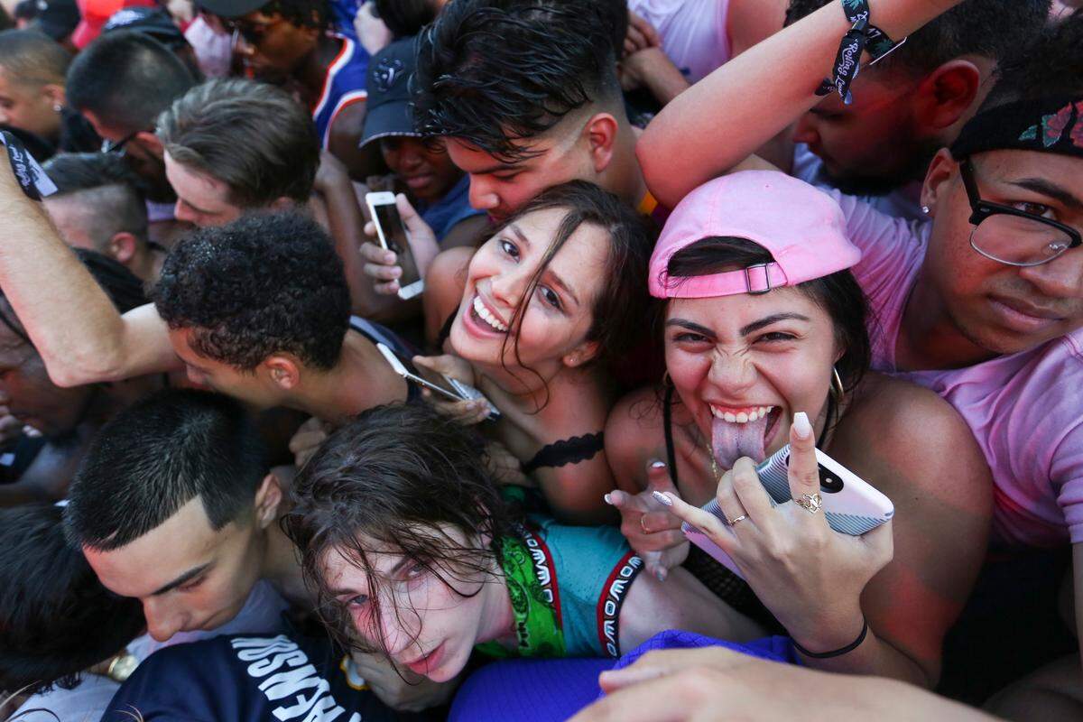 Festival-goers get squished during XXXTentacion’s performance during the second day of the Rolling Loud Festival in downtown Miami on Saturday, May 6, 2017.