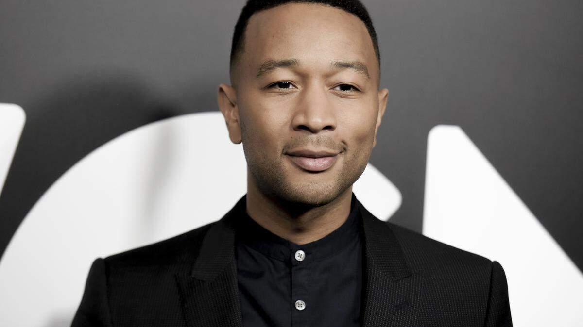 FILE - In this Friday, Jan. 13, 2017, file photo, John Legend attends a photo call for WGN America's "Underground" at the CTAM portion of the 2017 Winter Television Critics Association press tour in Pasadena, Calif. The producer of the Grammy Awards said Legend and Broadway star Cynthia Erivo will perform during the show’s In Memoriam segment on Sunday, Feb. 12, 2017. They will perform the Beach Boys’ “God Only Knows.” (Photo by Richard Shotwell/Invision/AP, File)