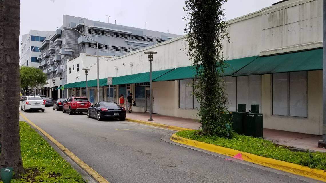 Pedestrians walk past vacant storefronts along Meridian Avenue and Lincoln Road on Wednesday, June 17.