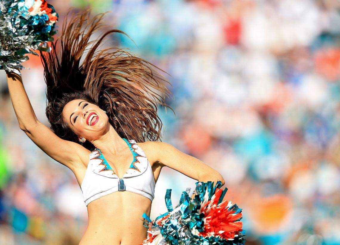 MIAMI GARDENS, FL - DECEMBER 27: A Miami Dolphins cheerleader performs during the second half of the game against the Indianapolis Colts at Sun Life Stadium on December 27, 2015 in Miami Gardens, Florida.  (Photo by Rob Foldy/Getty Images)