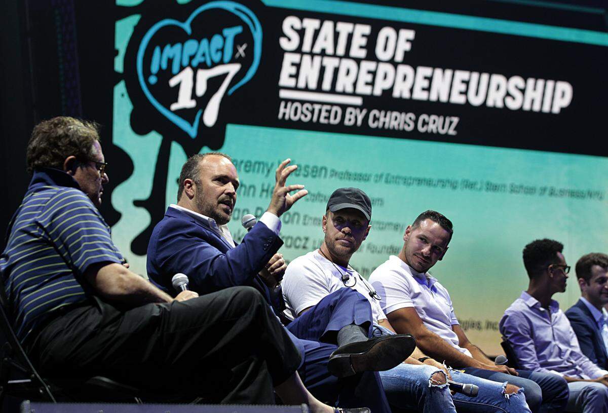Ivan Parron (second from left), an entertainment attorney speaks at the "State of Entrepreneurship panel" during the IMPACT '17 Conference, a one-day annual event centered around music, technology, fashion and art, at the University of Miami Watsco Center in Coral Gables on Thursday June 29, 2017.