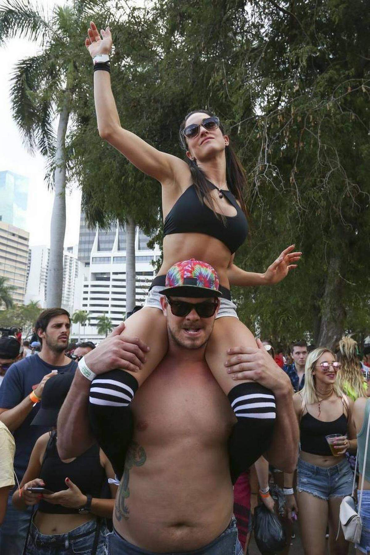 Caroline, 30, and Vincent, 36, from Montreal, dance during the first day of the Ultra Music Festival in Bayfront Park on Friday, March 24, 2017.