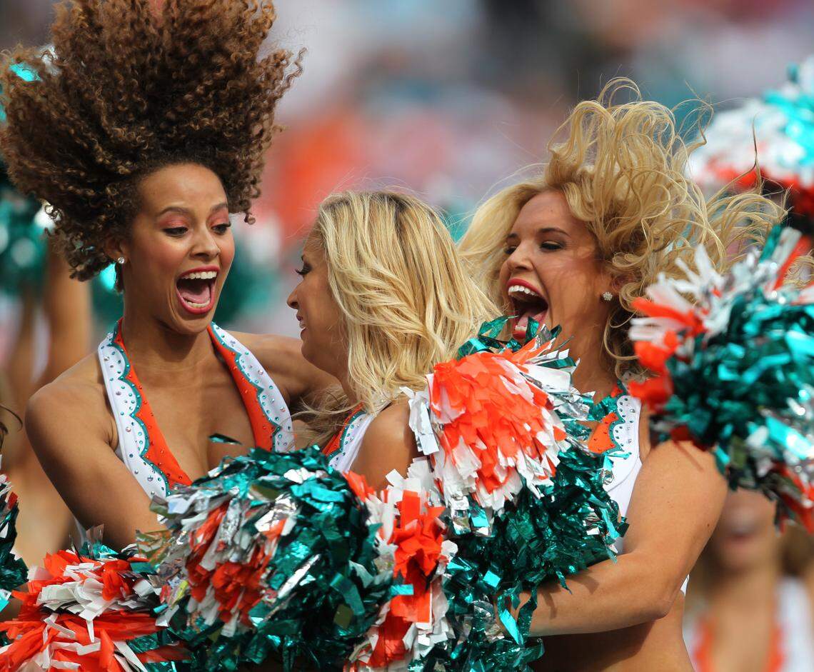 The Miami Dolphins' cheerleaders are ecstatic as Fabiola Romero (center) is chosen to represent them at the Pro Bowl in Hawaii in the second quarter in the game with the Buffalo Bills at Sun Life Stadium in Miami Gardens.December 19,2010.