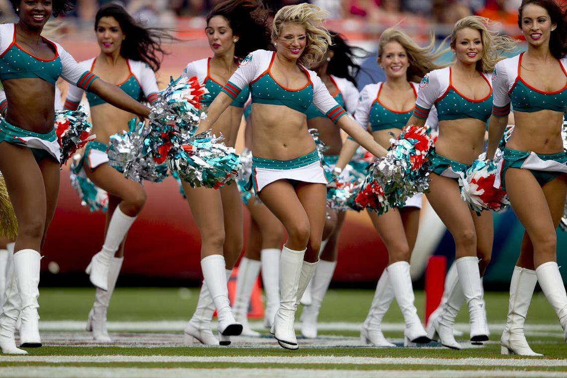 Miami Dolphins cheerleaders enter end zone to entertain at the end of the first quarter of the game with the Miami Dolphins and the New England Patriots at Sun Life Stadium in Miami Gardens on December 2,2012.