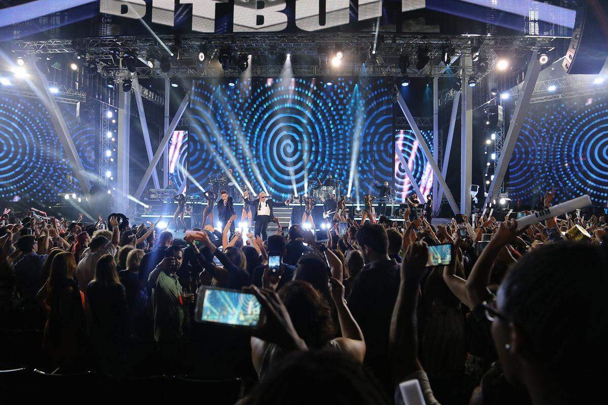 Pitbull and New Year’s Eve go together like Miami and overpriced bottle service.