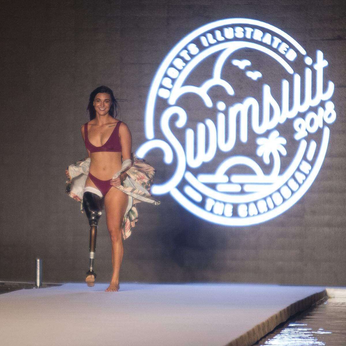 Model/paralympian Brenna Huckaby walks the runway for the 2018 Sports Illustrated Swimsuit show at PARAISO during Miami Swim Week at The W Hotel South Beach in Miami Beach, FL, on July 15, 2018.