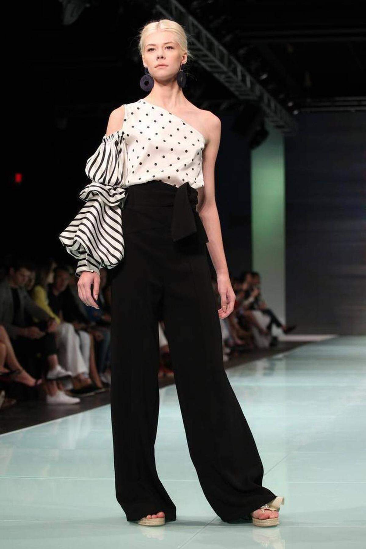 Fashion models work the runway wearing the fashion line by Miami designer Silvia Tcherassi inside the Ice Palace during Miami Fashion Week on Thursday, June 1, 2017.